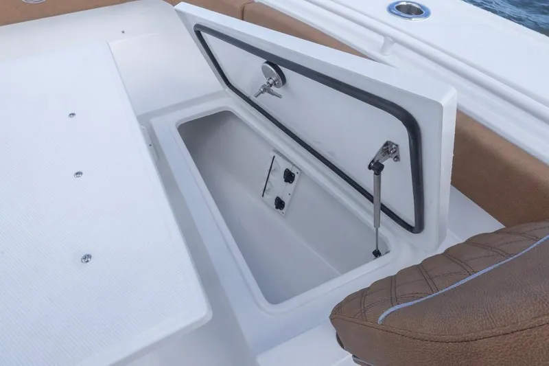 Slide: The Image of Open storage compartment on 2026 Sea Hunt Ultra 275 SE boat. - 5