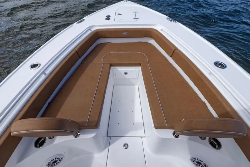 Slide: The Image of 2026 Sea Hunt Ultra 275 SE boat with spacious brown seating and sleek design. - 8