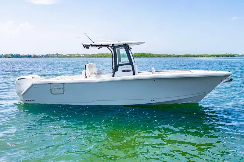 The Image of 2026 Sea Hunt Gamefish 27 Forward Seating boat on clear blue water. - 0