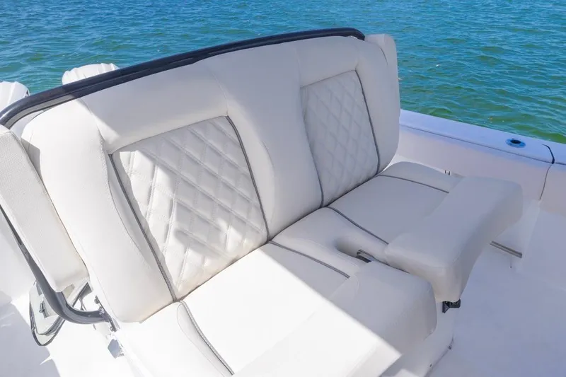 Slide: The Image of 2026 Sea Hunt Gamefish 27 Forward Seating with luxurious white upholstery on a sunny day. - 12
