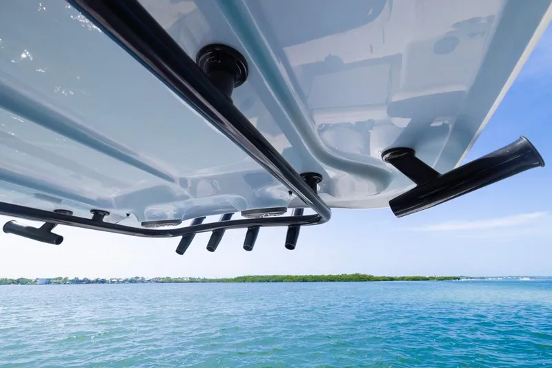 Slide: The Image of 2026 Sea Hunt Gamefish 27 boat underside with rod holders, ocean view. - 21