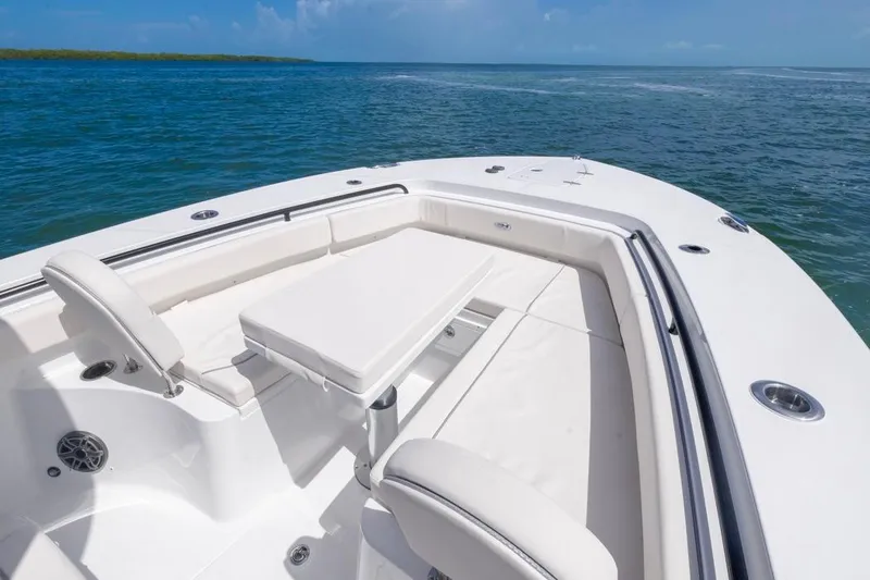 Slide: The Image of 2026 Sea Hunt Gamefish 27 Forward Seating boat with spacious deck and ocean view. - 4