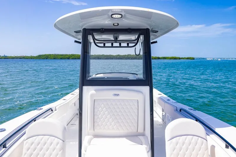 Slide: The Image of 2026 Sea Hunt Gamefish 27 boat with forward seating on open water. - 7