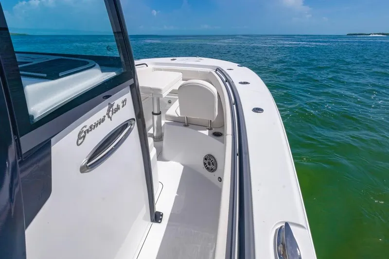 Slide: The Image of 2026 Sea Hunt Gamefish 27 boat with forward seating on open water. - 9