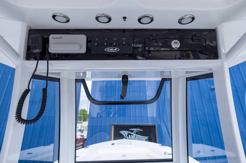 Slide: The Image of Interior view of 2026 Sea Hunt Gamefish 27 Coffin Box boat console with Garmin equipment. - 11