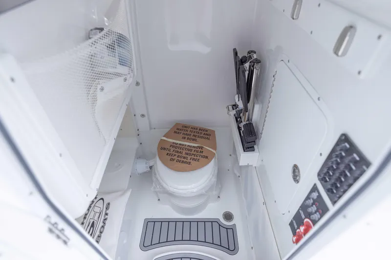 Slide: The Image of 2026 Sea Hunt Gamefish 27 Coffin Box interior with storage and control panel. - 12