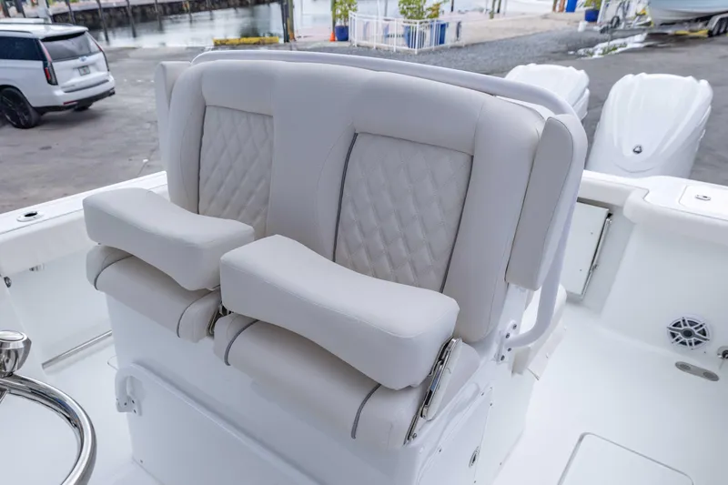 Slide: The Image of 2026 Sea Hunt Gamefish 27 Coffin Box boat seating with luxurious white upholstery. - 13