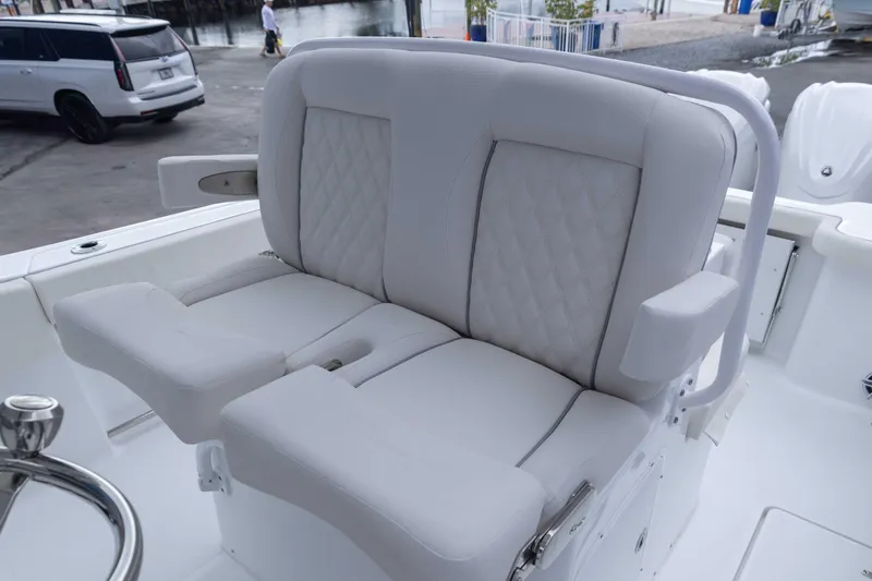 Slide: The Image of 2026 Sea Hunt Gamefish 27 Coffin Box boat seating, featuring luxurious white upholstery. - 14
