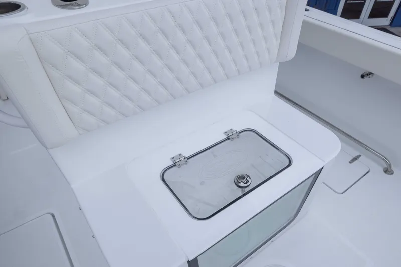 Slide: The Image of 2026 Sea Hunt Gamefish 27 Coffin Box with white quilted seating and storage compartment. - 16