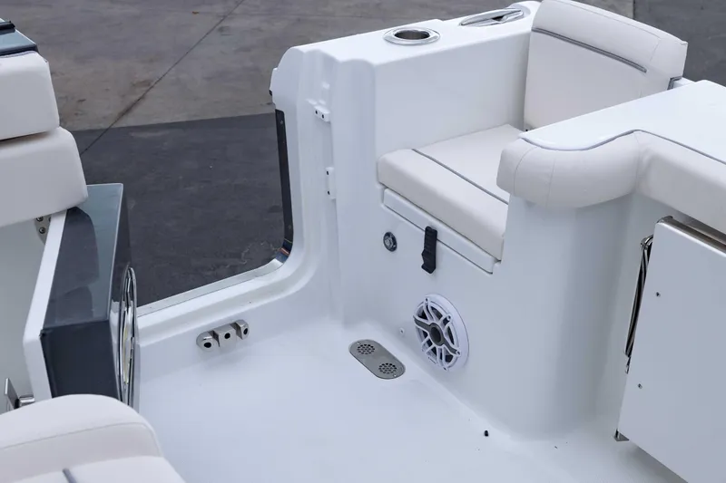Slide: The Image of 2026 Sea Hunt Gamefish 27 Coffin Box boat interior with seating and speaker. - 19