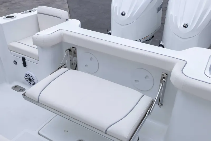 Slide: The Image of 2026 Sea Hunt Gamefish 27 Coffin Box boat interior with white seating and dual engines. - 20