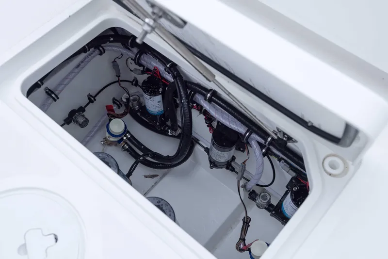 Slide: The Image of 2026 Sea Hunt Gamefish 27 Coffin Box interior showing wiring and components. - 24