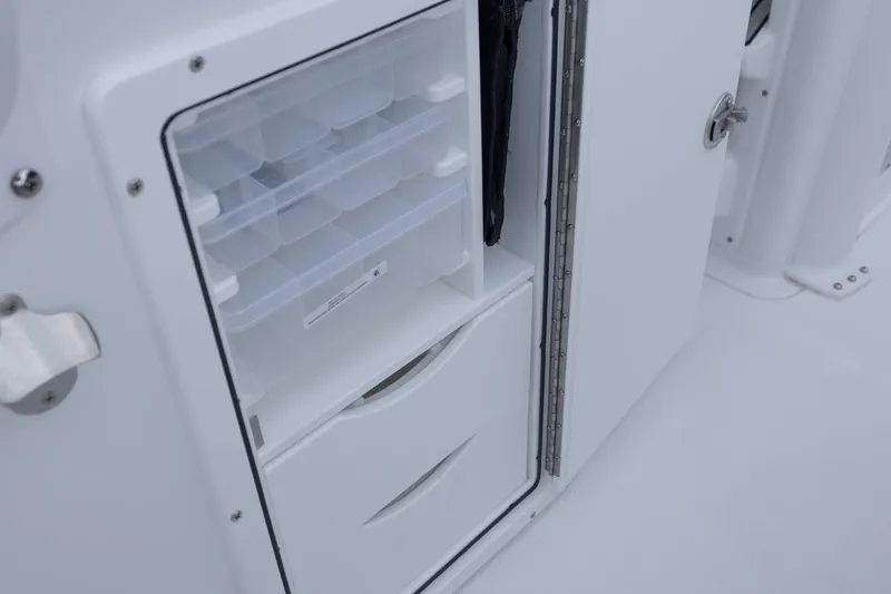 Slide: The Image of 2026 Sea Hunt Gamefish 27 Coffin Box storage compartment with organized trays and drawers. - 26