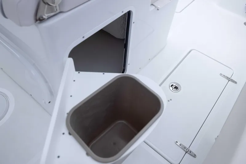 Slide: The Image of 2026 Sea Hunt Gamefish 27 Coffin Box interior, featuring storage compartments and seating area. - 28