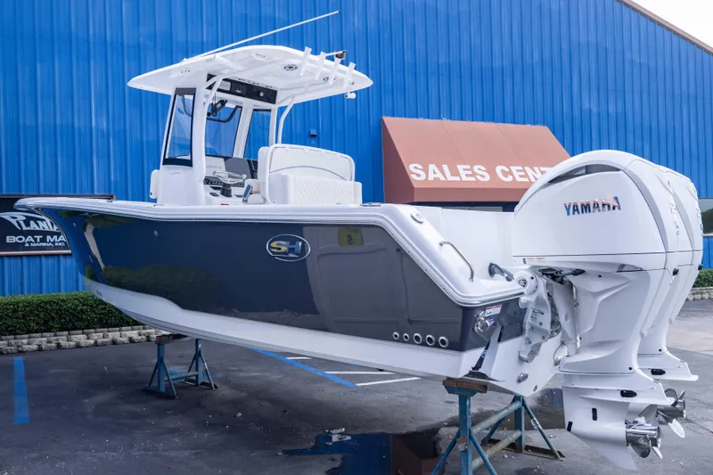 Slide: The Image of 2026 Sea Hunt Gamefish 27 Coffin Box boat displayed at sales center. - 3