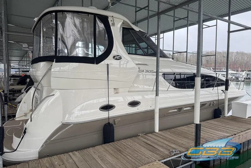 The Image of 2006 Sea Ray 40 Motor Yacht docked in a covered marina. - 0