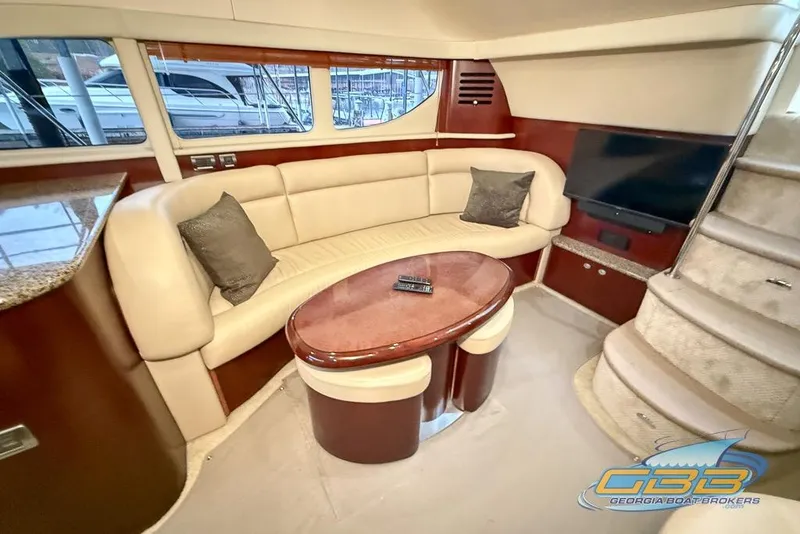 Slide: The Image of Luxurious interior of 2006 Sea Ray 40 Motor Yacht with plush seating and TV. - 11