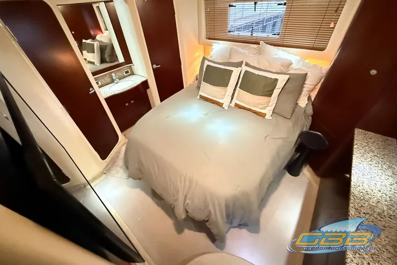 Slide: The Image of Luxurious bedroom interior of 2006 Sea Ray 40 Motor Yacht with cozy bedding. - 15