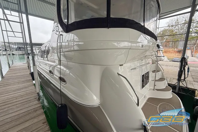 Slide: The Image of 2006 Sea Ray 40 Motor Yacht docked at marina, side view. - 2