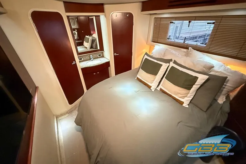Slide: The Image of Luxurious bedroom interior of 2006 Sea Ray 40 Motor Yacht with elegant bedding and wood accents. - 20
