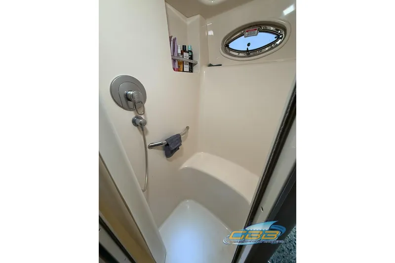 Slide: The Image of Shower area in 2006 Sea Ray 40 Motor Yacht with porthole and toiletries. - 22