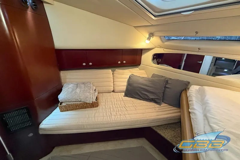 Slide: The Image of Luxurious 2006 Sea Ray 40 Motor Yacht interior with cozy bedding and elegant wood finish. - 23