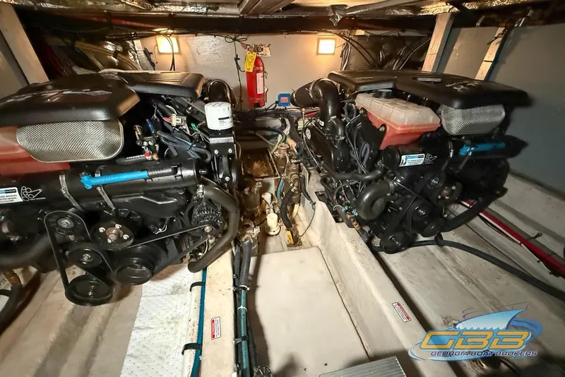 Slide: The Image of Engine room of 2006 Sea Ray 40 Motor Yacht with dual engines and fire extinguisher. - 28