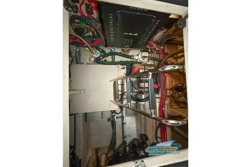 Slide: The Image of Engine compartment of 2006 Sea Ray 40 Motor Yacht with wiring and control panel. - 29