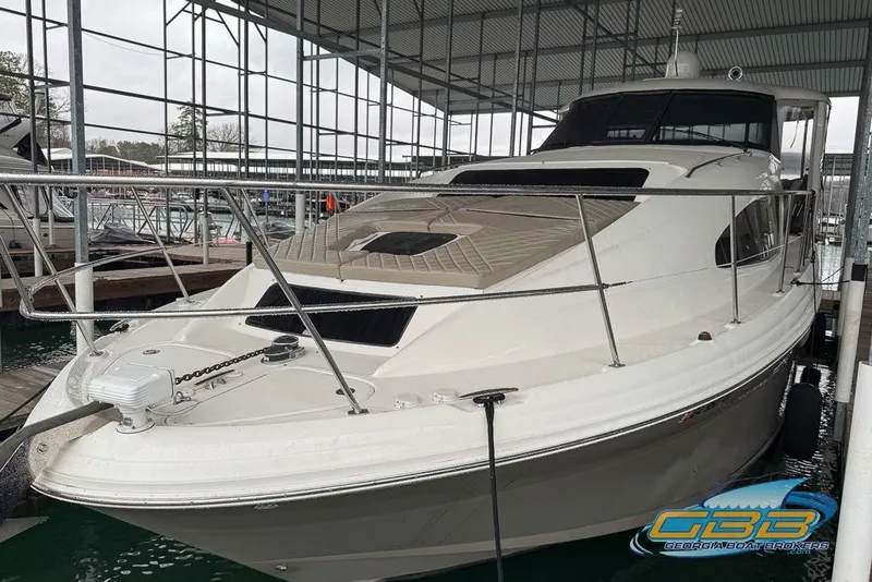 Slide: The Image of 2006 Sea Ray 40 Motor Yacht docked in a marina under a covered structure. - 3
