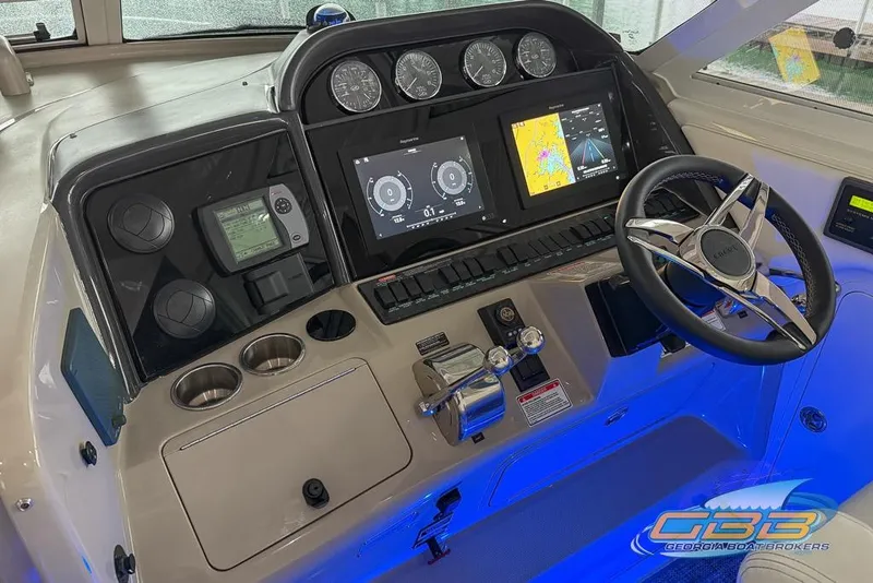Slide: The Image of 2006 Sea Ray 40 Motor Yacht helm with advanced navigation and control systems. - 30