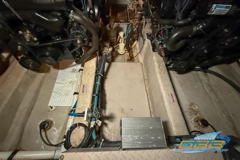 Slide: The Image of Engine room of a 2006 Sea Ray 40 Motor Yacht, showcasing mechanical components. - 37