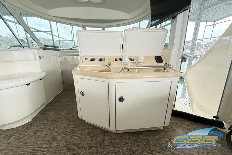 Slide: The Image of 2006 Sea Ray 40 Motor Yacht interior with sink and seating area. - 40