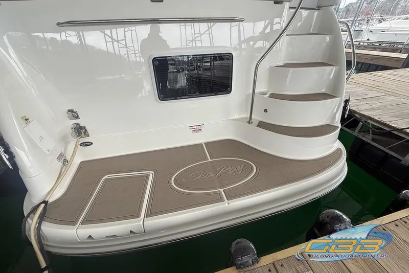 Slide: The Image of 2006 Sea Ray 40 Motor Yacht stern with steps and docked at marina. - 5