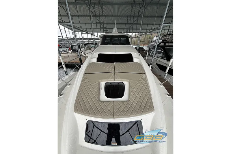 Slide: The Image of 2006 Sea Ray 40 Motor Yacht docked under a covered marina. - 6