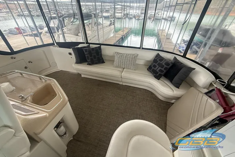 Slide: The Image of Luxurious interior of 2006 Sea Ray 40 Motor Yacht with plush seating and scenic marina view. - 8