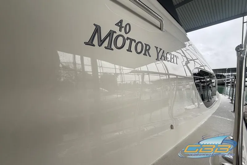 Slide: The Image of 2006 Sea Ray 40 Motor Yacht docked at marina, side view. - 9