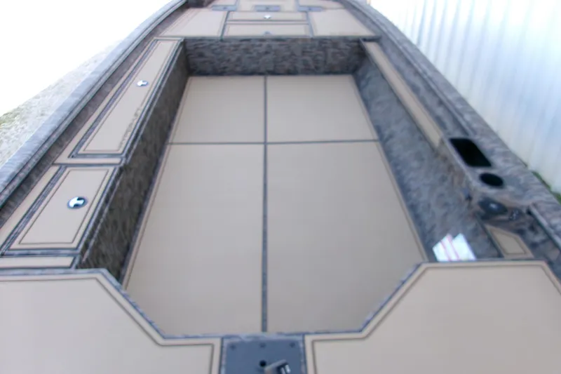 Slide: The Image of 2026 Xpress X18DB boat interior with spacious deck and storage compartments. - 17