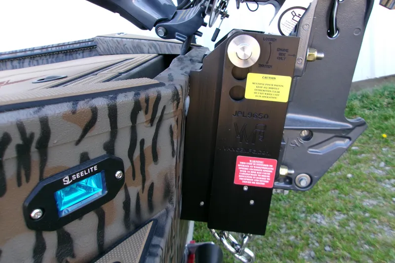 Slide: The Image of 2026 Xpress X18DB boat with camo design and Seelite lighting detail. - 21