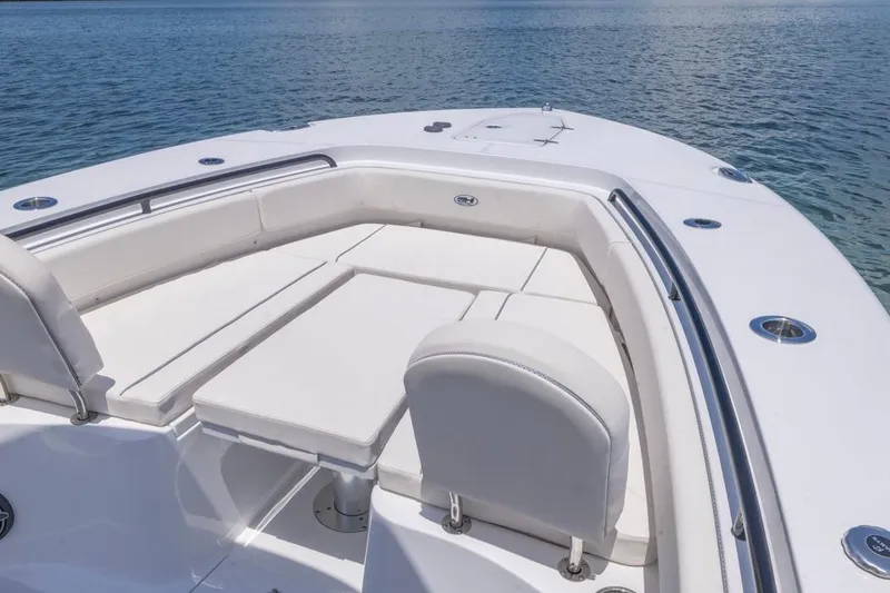 Slide: The Image of 2026 Sea Hunt Gamefish 25 boat with spacious seating on calm water. - 2