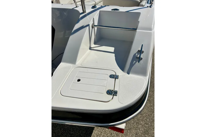 Slide: The Image of 2004 Starcraft Aurora 2000 OB boat deck with storage compartment and railing. - 11