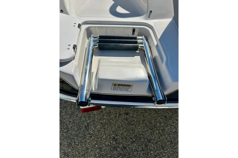 Slide: The Image of 2004 Starcraft Aurora 2000 OB boat ladder on deck, featuring stainless steel construction. - 13