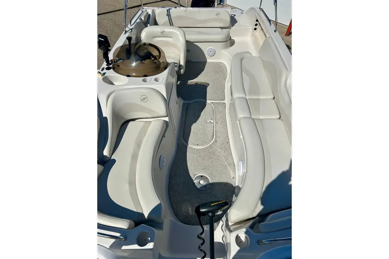 Slide: The Image of 2004 Starcraft Aurora 2000 OB boat interior with seating and steering console. - 18