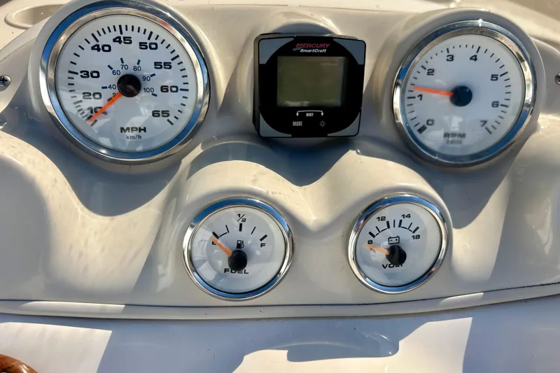 Slide: The Image of Dashboard of 2004 Starcraft Aurora 2000 OB boat with gauges and Mercury SmartCraft display. - 31