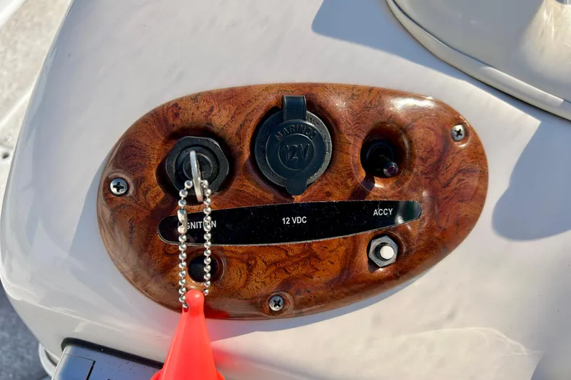 Slide: The Image of 2004 Starcraft Aurora 2000 OB ignition panel with key and 12V socket. - 32