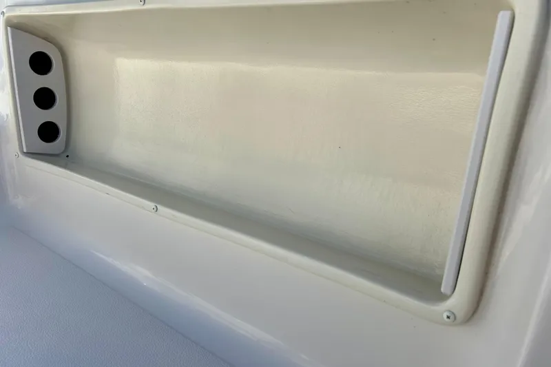 Slide: The Image of Interior detail of 2004 Starcraft Aurora 2000 OB boat, featuring a storage compartment. - 46