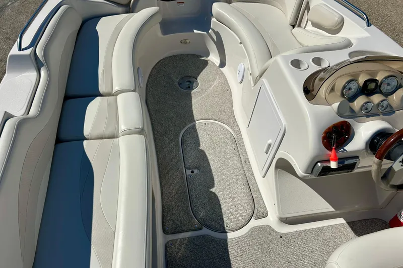 Slide: The Image of 2004 Starcraft Aurora 2000 OB boat interior with plush seating and control panel. - 48