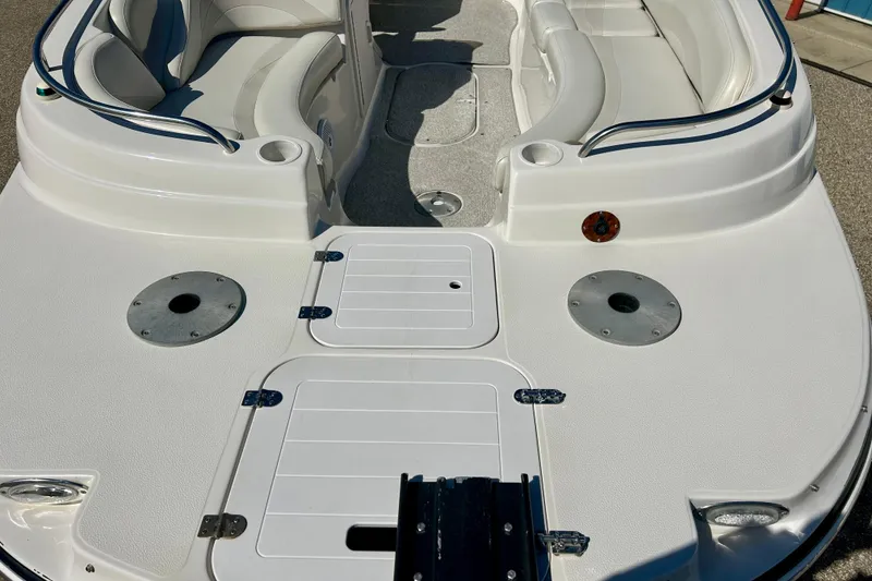 Slide: The Image of 2004 Starcraft Aurora 2000 OB boat interior with white seating and deck layout. - 54