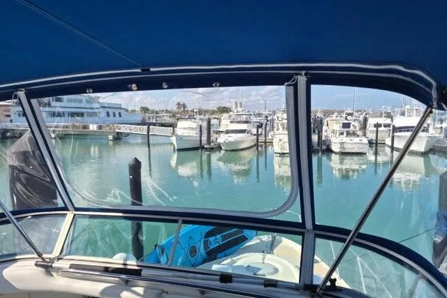 Slide: The Image of View from 1999 Maxum 4100 SCA yacht, overlooking marina with docked boats. - 2