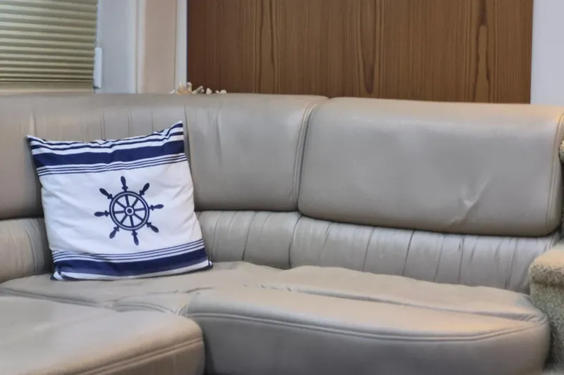 Slide: The Image of Beige leather sofa with nautical-themed pillow on Maxum 4100 SCA yacht, 1999 model. - 9