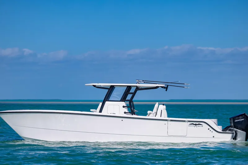 The Image of 2025 Invincible 35 Catamaran cruising on clear blue waters under a sunny sky. - 0